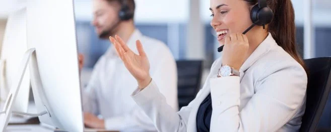 A Smiling Customer Support Agent In An Office