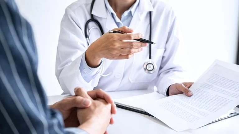 Doctor Discussing Medical Documents with Patient