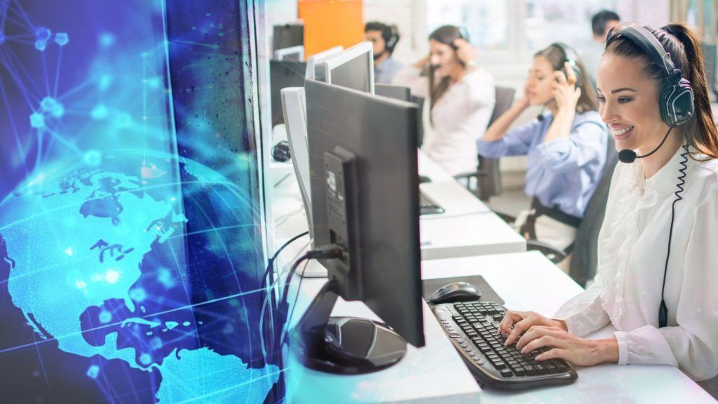 Call Center Agents Working with Computers