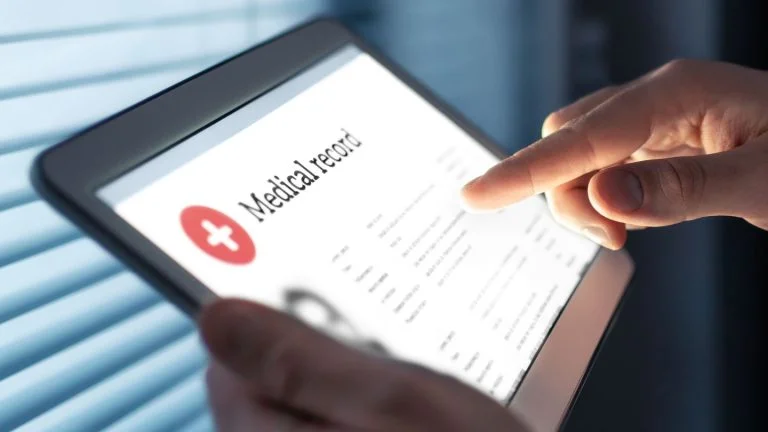 Person Accessing Digital Medical Record on Tablet